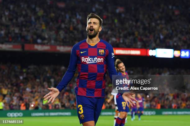 Gerard Pique of FC Barcelona celebrates as he scores his team's third goal during the Liga match between FC Barcelona and Valencia CF at Camp Nou on...