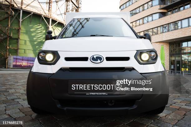 The upgraded StreetScooter GmbH 'Work' cargo electric van sits on display ahead of its official unveiling at the European Energy Forum Campus in...