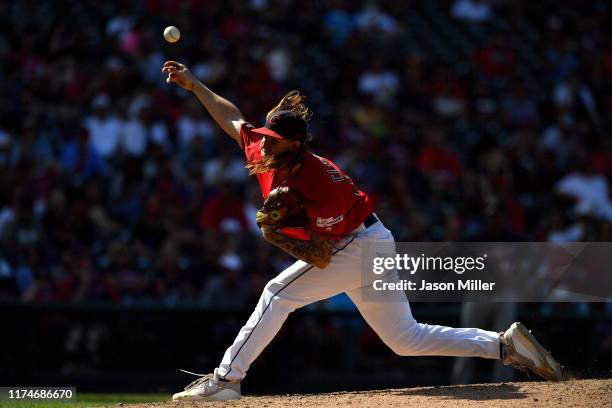 Starting pitcher Mike Clevinger of the Cleveland Indians pitches during the eighth inning of the first game of a double header against the Minnesota...