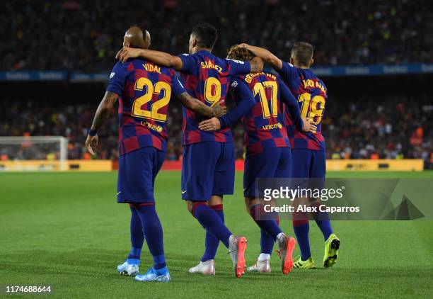 Luis Suarez of FC Barcelona celebrates as he scores his team's fifth goal with Arturo Vidal , Antoine Griezmann and Jordi Alba during the Liga match...