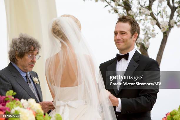 Michael Vartan and Lauren Skaar exchange vows at their wedding ceremony officiated by Michael's stepfather Ian LaFrenais at The Resort at Pelican...