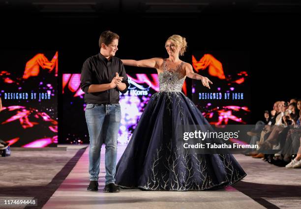 Designer Joshua Bartfeld Birchjones with Kiera Chaplin wearing one of his designs, a dress which is being sold for £50 000, on the runway at the...