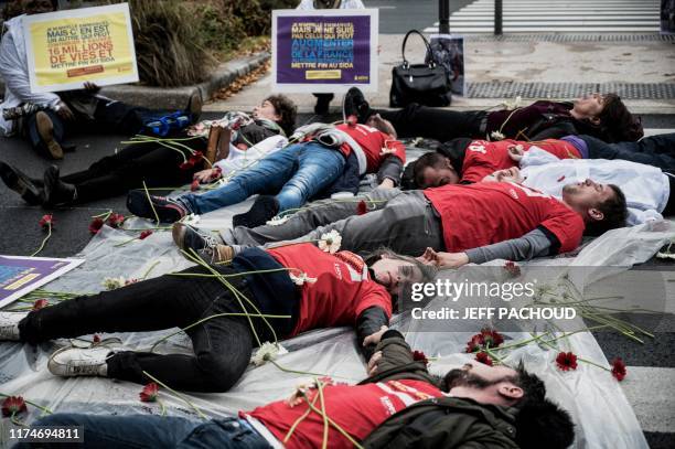 Members of French NGO Aides protest outside the venue of Sixth Replenishment Conference of the Global Fund to Fight AIDS, Tuberculosis and Malaria,...