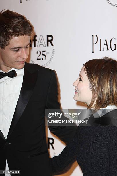 Max Irons and Emily Browning attend the amfAR Inspiration Gala photocall at Pavillon Gabriel on June 23, 2011 in Paris, France.