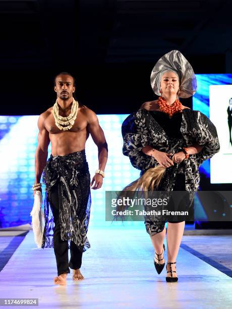 Models walk the runway for NHN at the House of iKons show at Hilton London Metropole on September 14, 2019 in London, England.