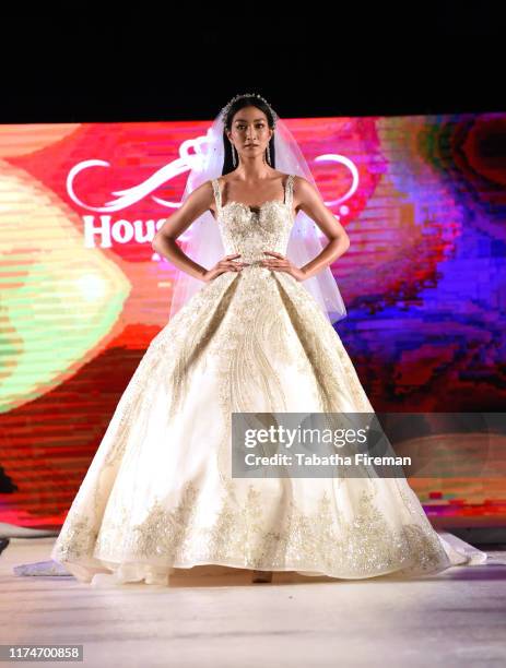 Model walks the runway for Finale Wedding Studio at the House of iKons show at Hilton London Metropole on September 14, 2019 in London, England.