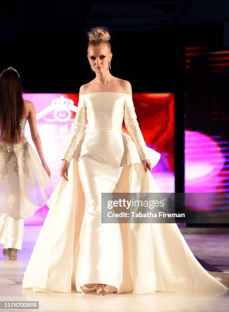 Model walks the runway for Finale Wedding Studio at the House of iKons show at Hilton London Metropole on September 14, 2019 in London, England.