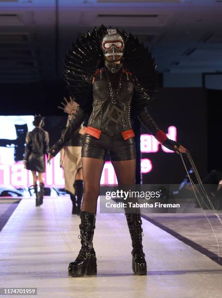 Model walks the runway for Michael Lombard at the House of iKons show at Hilton London Metropole on September 14, 2019 in London, England.