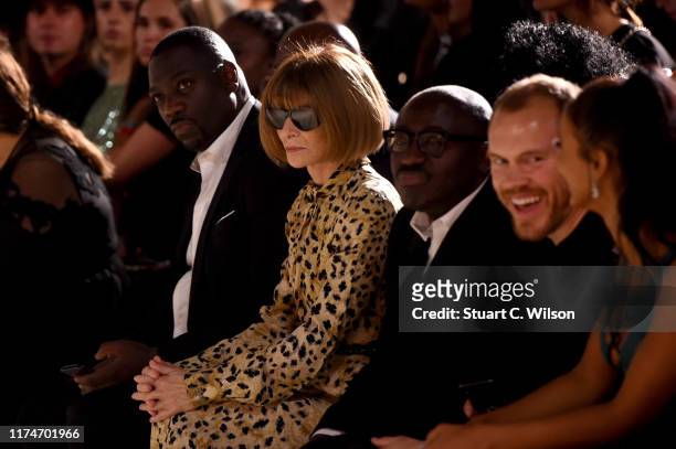 Anna Wintour and Edward Enninful watch from the front row during the Fashion For Relief catwalk show London 2019 at The British Museum on September...
