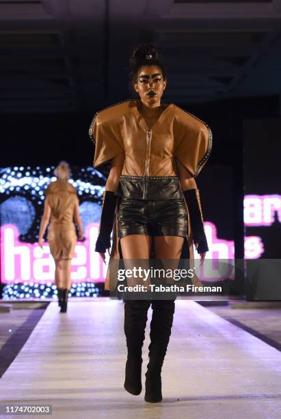 Model walks the runway for Michael Lombard at the House of iKons show at Hilton London Metropole on September 14, 2019 in London, England.