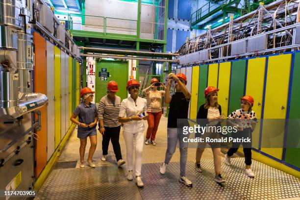 Visitors enter to Point 4 to see the LHC tunnels and Radio-Frequency cavities during the Open Days at the CERN particle physics research facility on...