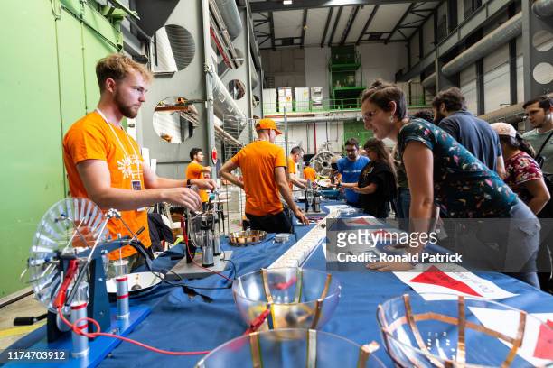 Scientists interact with visitors during the Open Days at the CERN particle physics research facility on September 14, 2019 in Meyrin, Switzerland....