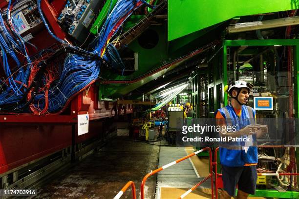Guide explains to visitors about the CSR experiment during the Open Days at the CERN particle physics research facility on September 14, 2019 in...