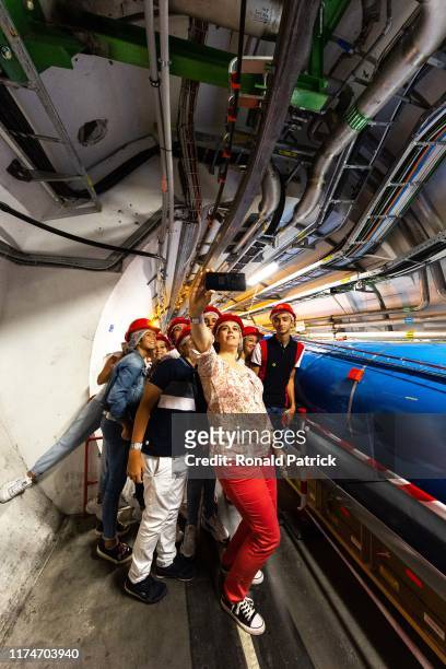 Visitors take a group selfie at the tunnels at the Point 4 section during the Open Days at the CERN particle physics research facility on September...
