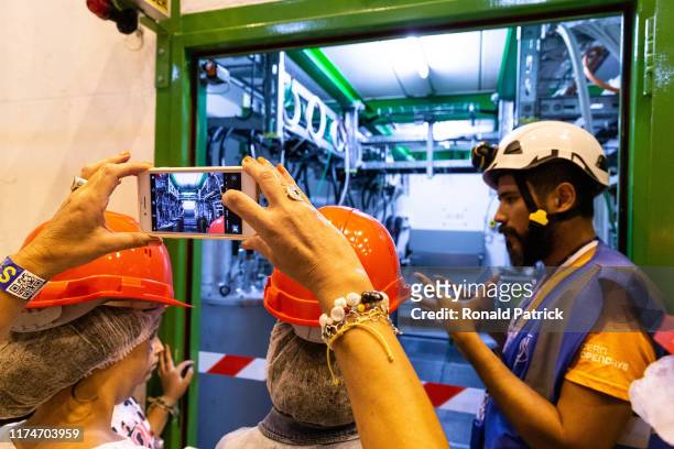 Visitors take pictures at Point 4 during the Open Days at the CERN particle physics research facility on September 14, 2019 in Meyrin, Switzerland....