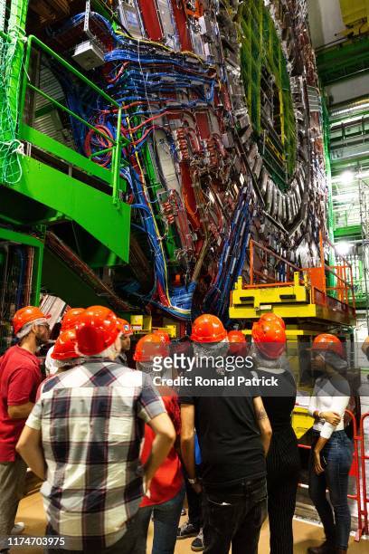 Visitors look at the 14.000 tone CMS detector is seen during the Open Days at the CERN particle physics research facility on September 14, 2019 in...