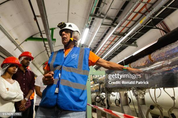 Scientist and guide talks to the visitors inside the tunnels at Point 6 of Cern, during the Open Days at the CERN particle physics research facility...