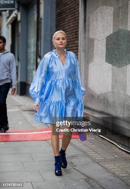 Pandora Sykes is seen wearing blue silk dress outside Rejina Pyo during London Fashion Week September 2019 on September 14, 2019 in London, England.