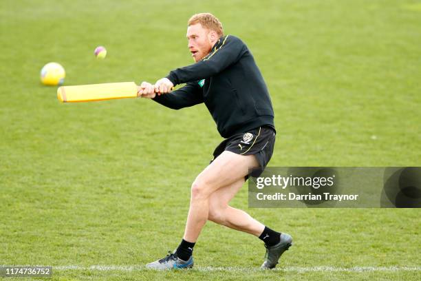 Nick Vlastuin of the Tigers takes part in a game of cricket during a Richmond Tigers AFL training session at Punt Road Oval on September 15, 2019 in...