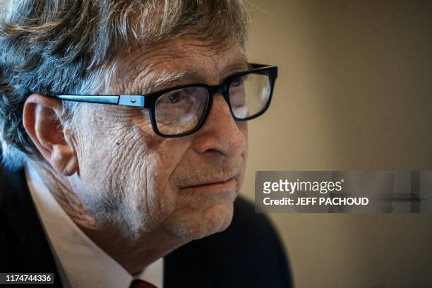 Microsoft founder, Co-Chairman of the Bill & Melinda Gates Foundation, Bill Gates, takes part in a conference call on October 9 in Lyon, central...