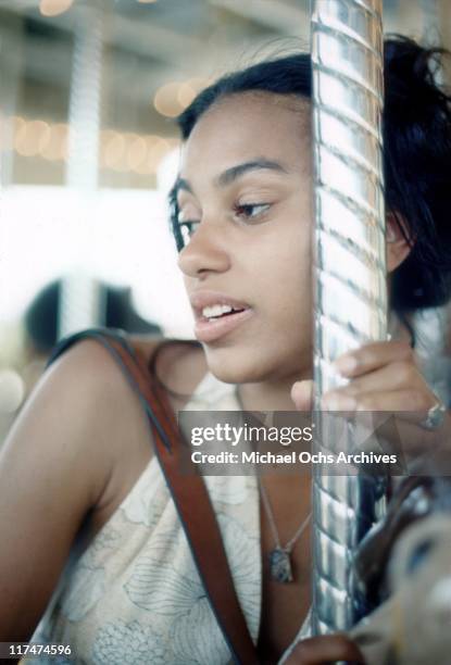 Olympia Sylvers of the R and B group The Sylvers on the carousel at Magic Mountain on June 22, 1973 in Valencia, California.