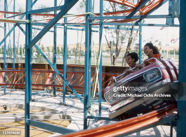 Charmaine Sylvers and Olympia Sylvers of the R and B group The Sylvers on a roller coaster at Magic Mountain on June 22, 1973 in Valencia, California.