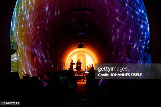 People listen to a concert of the "Death of Classical" series at the Greenwood Cemetery on October 8, 2019 in New York City. - Deep in one of New...