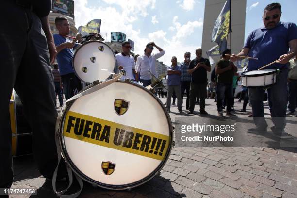 Banner reading in Spanish 'Get out Uber' is seen during a taxi drivers protest against Uber and Cabify applications in Buenos Aires, Argentina on 9...