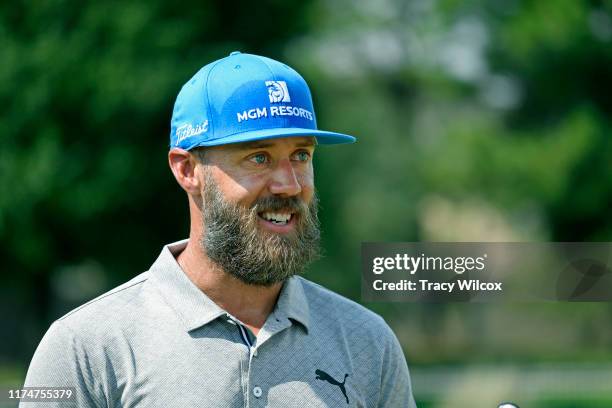 Graham DeLaet of Canada gives some key golf lessons to a group of Houston Astros employees prior to the Houston Open at the Golf Club of Houston on...