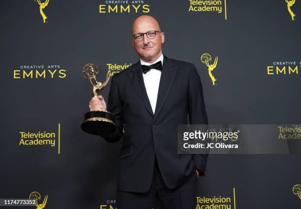 Director Dan Reed poses in the press room with the award for outstanding documentary or nonfiction special for Leaving Neverland' during the 2019...