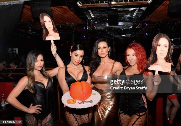 Birthday cake is presented to adult film actress Kendra Lust during her birthday party at the Crazy Horse 3 Gentlemen's Club on September 14, 2019 in...