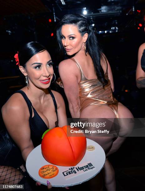 Birthday cake is presented to adult film actress Kendra Lust during her birthday celebration at the Crazy Horse 3 Gentlemen's Club on September 14,...