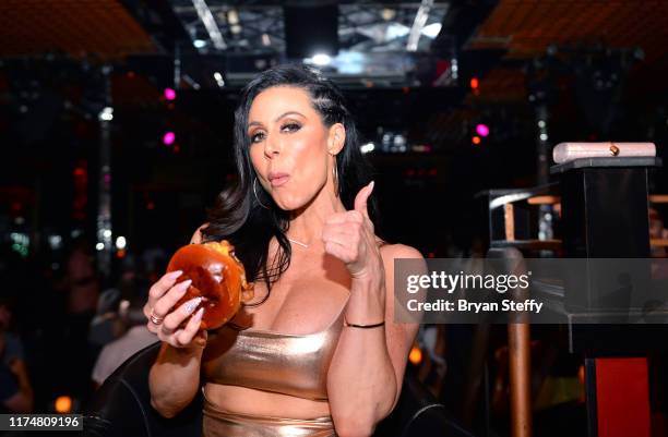 Adult film actress Kendra Lust samples Crazy Horse 3's signature burger during her birthday celebration at the Crazy Horse 3 Gentlemen's Club on...