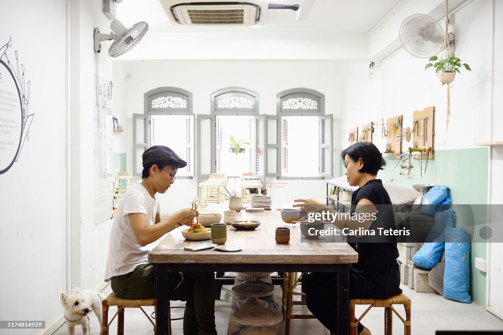 Colleagues eating lunch in their work studio