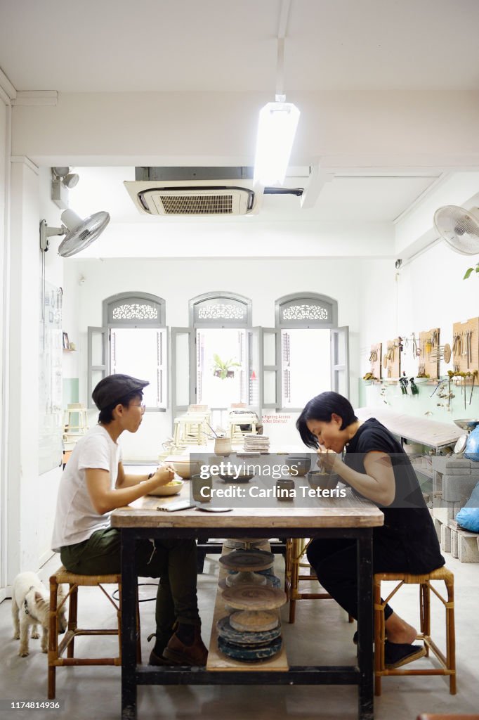 Colleagues eating lunch in their work studio