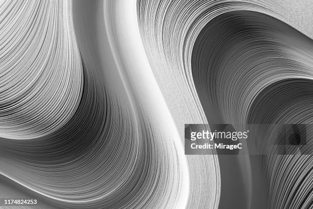 wave shaped paper pile - curled up stock-fotos und bilder