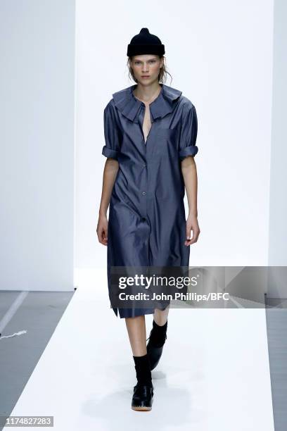 Model walks the runway at the Margaret Howell show during London Fashion Week September 2019 at Rambert on September 15, 2019 in London, England.