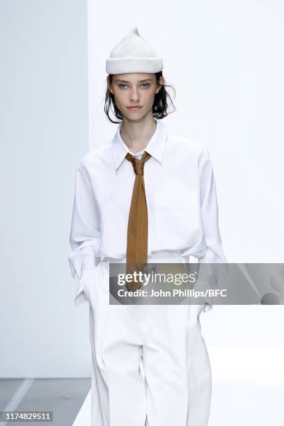 Model walks the runway at the Margaret Howell show during London Fashion Week September 2019 at Rambert on September 15, 2019 in London, England.