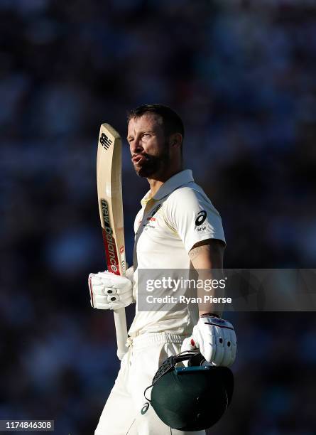 Matthew Wade of Australia celebrates after reaching his century during day four of the 5th Specsavers Ashes Test between England and Australia at The...