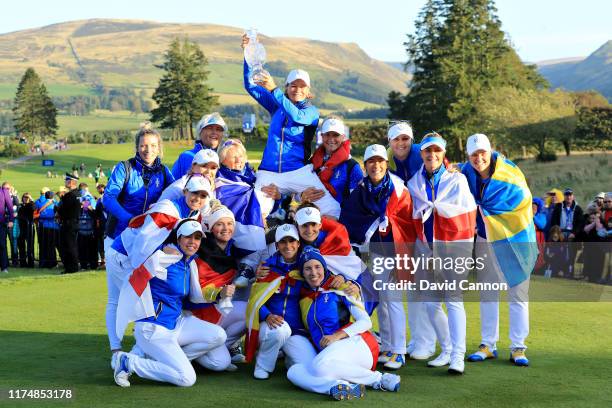 Team Europe celebrate winning the Solheim Cup during the final day singles matches of the Solheim Cup at Gleneagles on September 15, 2019 in...