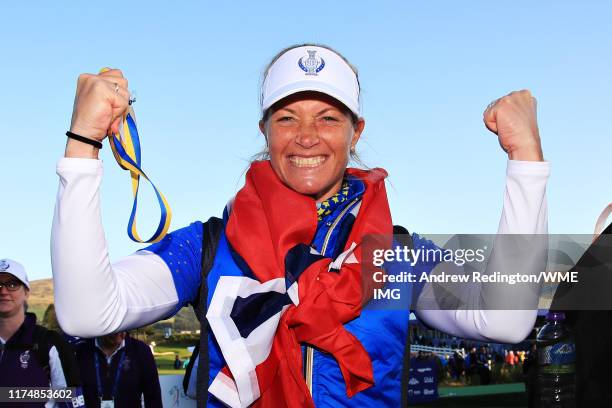 Suzann Pettersen of Team Europe celebrates her team winning the Solheim Cup during the final day singles matches of the Solheim Cup at Gleneagles on...