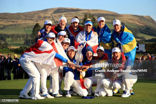 Team Europe celebrate winning the Solheim Cup during the final day singles matches of the Solheim Cup at Gleneagles on September 15, 2019 in...
