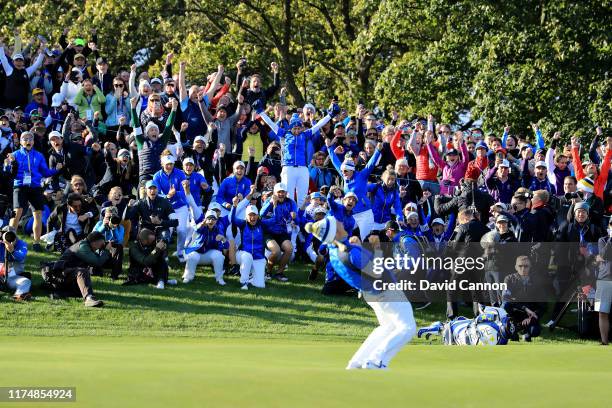 Team Europe celebrate as Suzann Pettersen of Team Europe putts to win her match and the tournament during the final day singles matches of the...