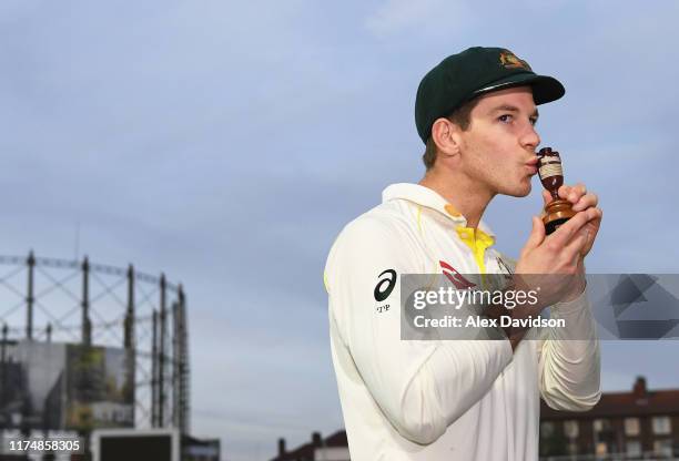 Captain of Australia Tim Paine poses with the Ashes Urn during Day Four of the 5th Specsavers Ashes Test between England and Australia at The Kia...