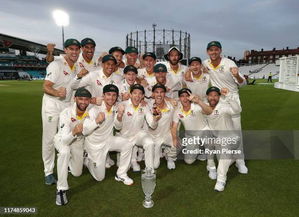 Australia celebrate with the Urn after Australian drew the series to retain the Ashes during day four of the 5th Specsavers Ashes Test between...