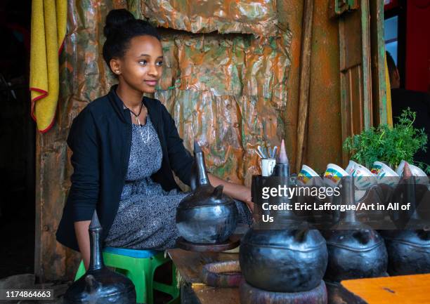 Ethiopian woman preparing coffee in a bar, Harari region, Harar, Ethiopia on August 8, 2019 in Harar, Ethiopia.