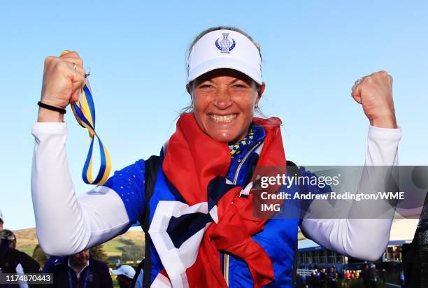 Suzann Pettersen of Team Europe celebrates her team winning the Solheim Cup during the final day singles matches of the Solheim Cup at Gleneagles on...