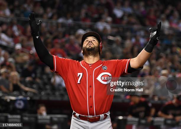 Eugenio Suarez of the Cincinnati Reds reacts after hitting a solo home run off of Zac Gallen of the Arizona Diamondbacks during the fourth inning at...