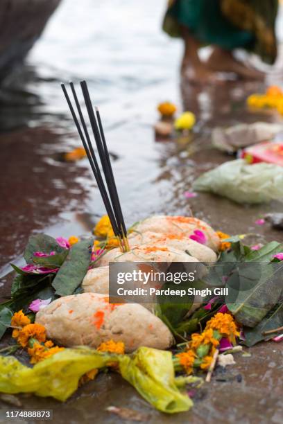 puja blessings from a hindu puja ceremony on a ghat in varanasi, india. - hinduism photos stock pictures, royalty-free photos & images