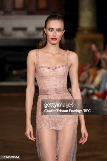 Model walks the runway at the AADNEVIK show during London Fashion Week September 2019 at The Royal Horseguards on September 15, 2019 in London,...